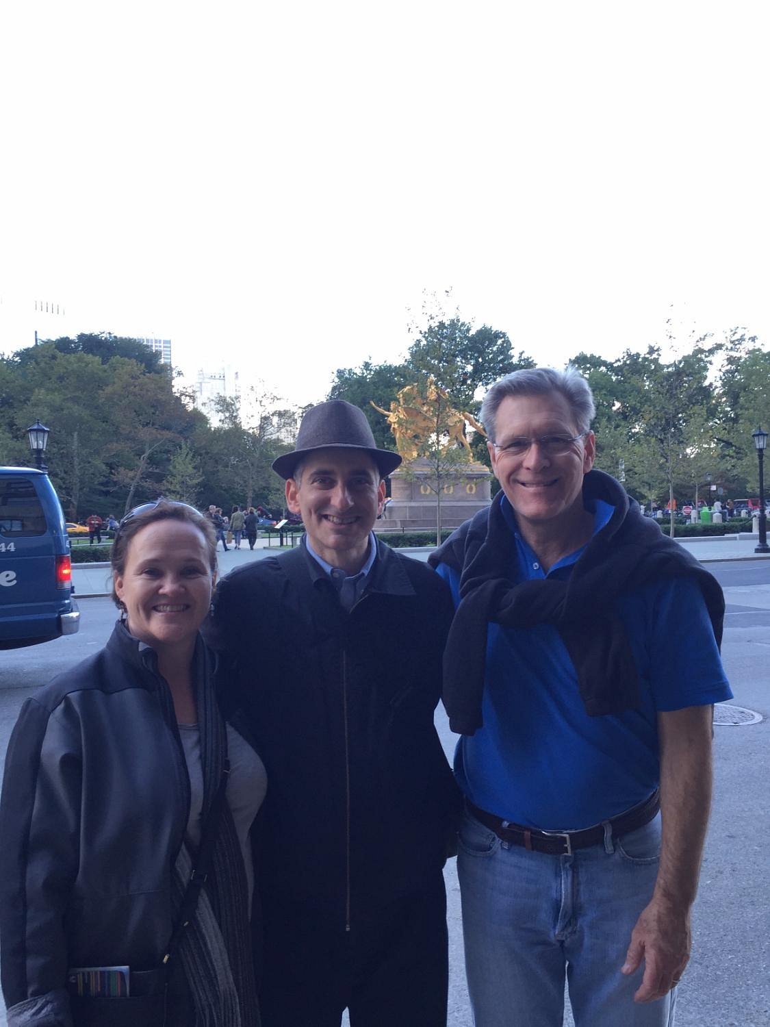 Jared standing with a couple after a private walking tour near Central Park's Grand Army Plaza