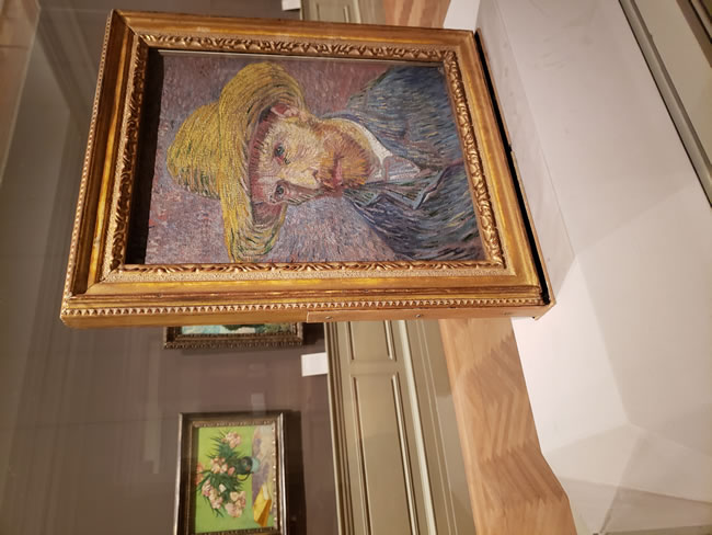 Van Gogh's self-portrait with a straw hat displayed at the Metropolitan Museum