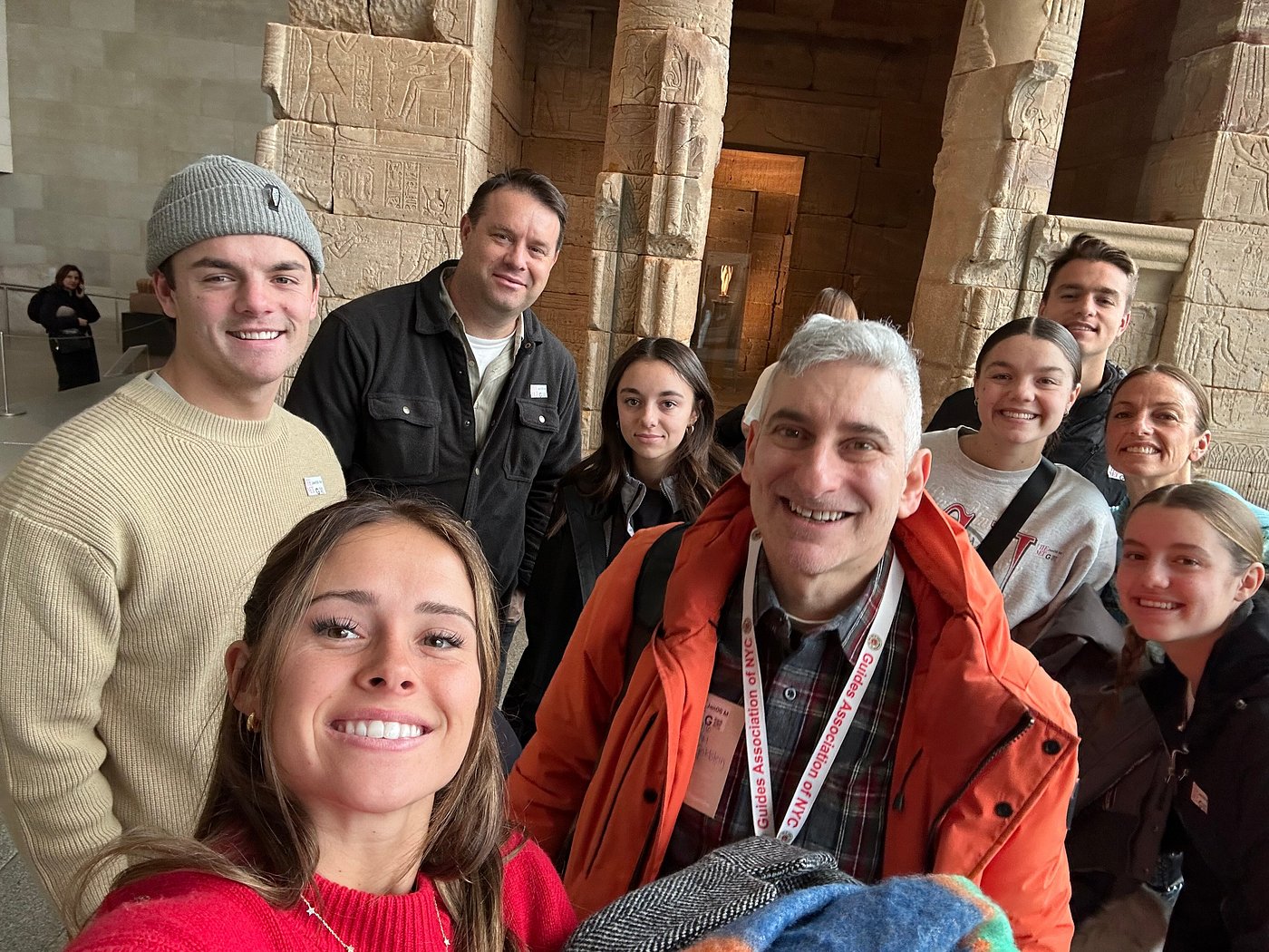Jared with a family group inside the Metropolitan Museum's Temple of Dendur