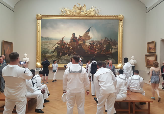 Sailors gathered in front of Emanuel Leutze's 'Washington Crossing the Delaware' at the Met