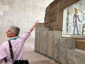 Jared pointing to Egyptian hieroglyphs and reliefs in the Metropolitan Museum's Egyptian wing