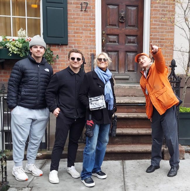 Jared with a small group in front of a classic Greenwich Village brownstone doorway